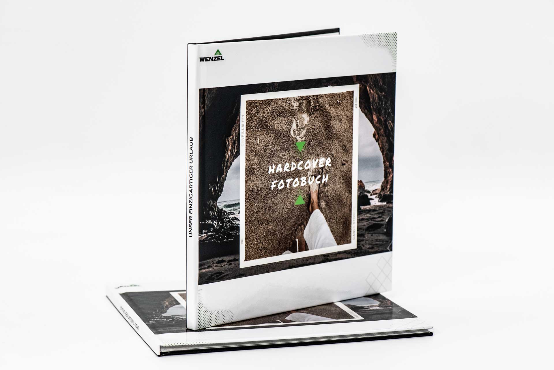 Two examples of hardback photo books, laid flat and standing upright