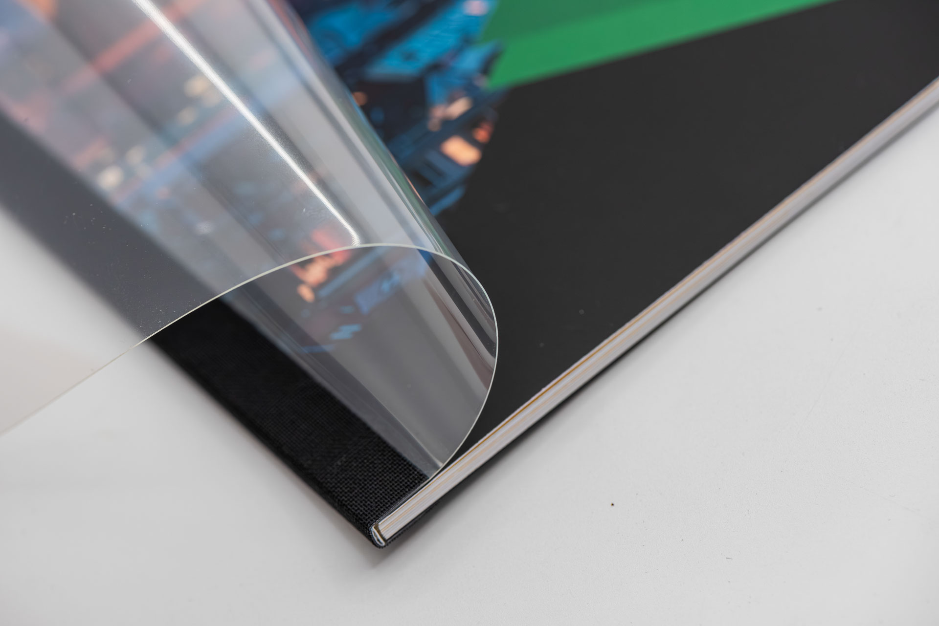 Close-up of a brochure with adhesive binding and the cover flap open